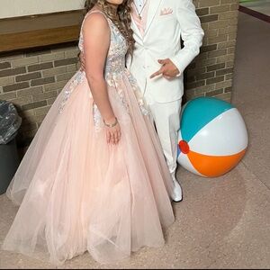 B This I a baby pink Jovani dress and it’s 830$ dress just asking for 500$